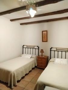 Tempat tidur dalam kamar di La Simona Casa Rural