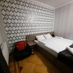 A bed or beds in a room at GIO-NIKA