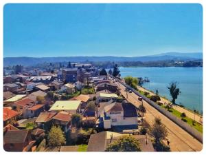 an aerial view of a town next to the water at Vista al río Calle - Calle in Valdivia