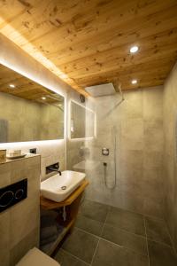 a bathroom with a sink and a shower at Apart Walser in Seefeld in Tirol