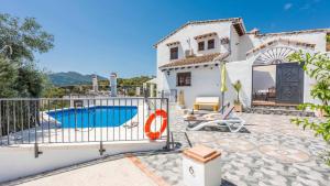 a villa with a swimming pool and a house at Casa Guajar 2 Monda by Ruralidays in Monda