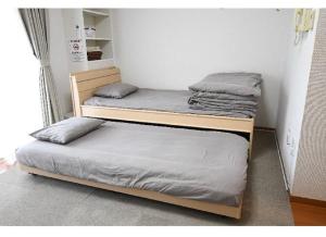 two bunk beds in a small room with at Marvelous Kokubunji - Vacation STAY 41073v in Kokubunji