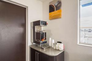a coffee machine sitting on top of a counter at Motel 6 Lost Hills / Buttonwillow Racetrack in Lost Hills