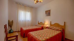 A bed or beds in a room at Casa Tejo Sedella by Ruralidays Még 13 kép
