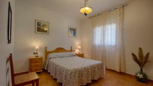 A bed or beds in a room at Casa Tejo Sedella by Ruralidays