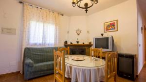 A television and/or entertainment centre at Casa Tejo Sedella by Ruralidays