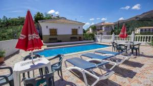 The swimming pool at or close to Casa Tejo Sedella by Ruralidays