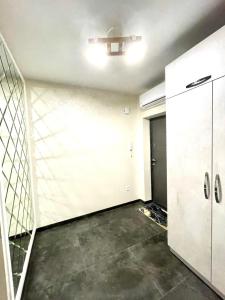 an empty room with a door and a wall at Resident Hall in Lviv