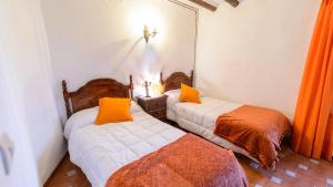 Postel nebo postele na pokoji v ubytování Casa Carmela Priego de Cordoba by Ruralidays