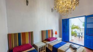 A bed or beds in a room at Villa El Patio Andaluz Velez-Malaga by Ruralidays Még 34 kép