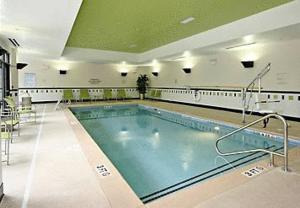 a large swimming pool in a large building at Fairfield Inn Suites Elkin Jonesville in Elkin