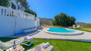 a house with a swimming pool in the yard at Finca El Mirador Malaga by Ruralidays in Málaga