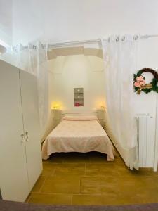 Säng eller sängar i ett rum på Civico 27