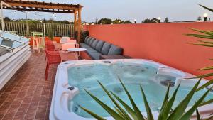 a hot tub sitting on top of a patio at Dar El Kif - La Marsa in La Marsa