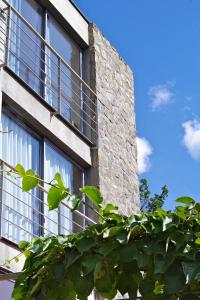 a brick building with windows on the side of it at Chambres d'hôtes Mas La Tardosse in Prats-de-Mollo-la-Preste