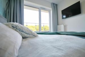 Katil atau katil-katil dalam bilik di SPA Nadmorskie Tarasy Nemo Apartamenty Kołobrzeg - Latarnia morska - Port +20 gambar