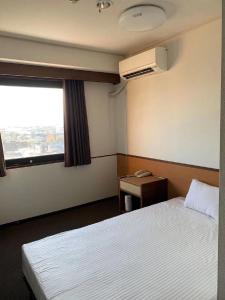 Postel nebo postele na pokoji v ubytování Ogaki Hiyori Hotel - Vacation STAY 72007v