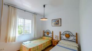 Posteľ alebo postele v izbe v ubytovaní Finca La Vina Competa by Ruralidays