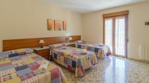 Posteľ alebo postele v izbe v ubytovaní Casita De Rufo Cenes de la Vega by Ruralidays + 21 fotografií