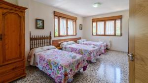 Posteľ alebo postele v izbe v ubytovaní Casita De Rufo Cenes de la Vega by Ruralidays