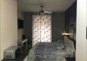 Cama ou camas em um quarto em Suite Lugo