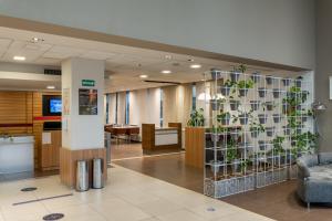 a lobby with a plant wall in a hospital at ibis Buenos Aires Congreso in Buenos Aires