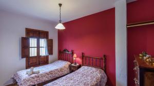 Ein Bett oder Betten in einem Zimmer der Unterkunft Casa La Vina del Arenal Pizarra by Ruralidays