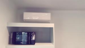 a white shelf with a laptop on top of it at 华人区花园别墅 in Temple City