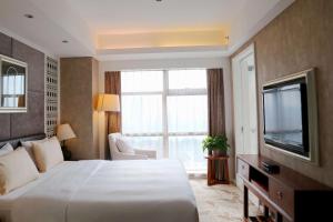 Cama ou camas em um quarto em Radisson Blu Hotel Liuzhou