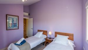 Postel nebo postele na pokoji v ubytování Casa Cupiana Malaga by Ruralidays