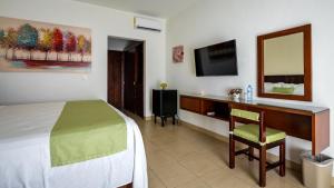 Postel nebo postele na pokoji v ubytování Imperla Hotel