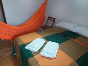 Katil atau katil-katil dalam bilik di Mansão Guajiru