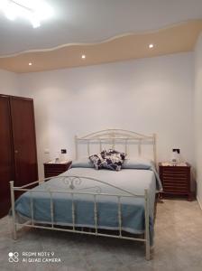 a bedroom with a large bed in a room at Antica Casa Cavaliere in Tramonti