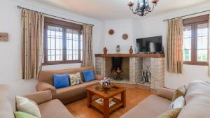 Televízia a/alebo spoločenská miestnosť v ubytovaní Casa El Mirador Iznajar by Ruralidays