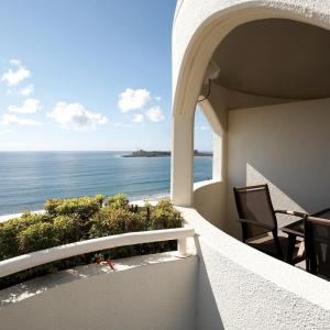 a view of the ocean from the balcony of a house at Mantra Zanzibar in Mooloolaba
