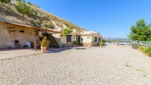 a house on the side of a hill at Cuevas El Mirador Pozo Alcon by Ruralidays in Pozo Alcón