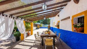 a table and chairs on the patio of a house at Cortijo La Vega Archidona by Ruralidays in Archidona