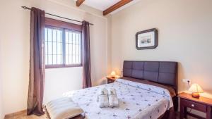 Postel nebo postele na pokoji v ubytování Villa Eugenia Torrox by Ruralidays