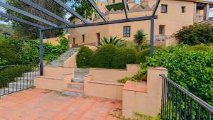 A garden outside Casa Rural Azahar Periana by Ruralidays