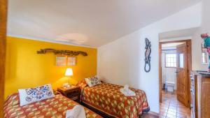 Ein Bett oder Betten in einem Zimmer der Unterkunft Finca Colores en el Viento Frigiliana by Ruralidays