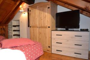 A television and/or entertainment centre at maison terme relax