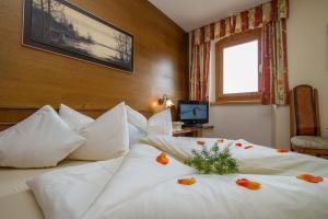 Rúm í herbergi á Hotel Metzgerwirt