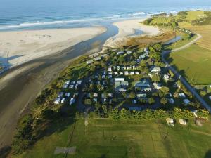 an aerial view of a resort near the beach at Pakiri Beach Holiday Park in Pakiri
