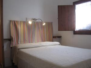 Postel nebo postele na pokoji v ubytování B&b Cinque Stalle