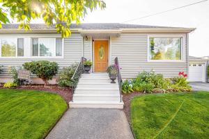a house with a staircase leading to the front door at Duplex in Alberta Art District in Portland