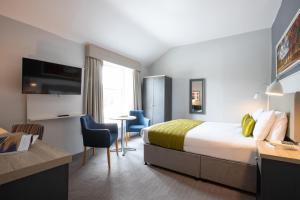 Voodi või voodid majutusasutuse George Hotel toas