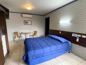 Postel nebo postele na pokoji v ubytování Grand Hotel Motel