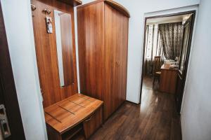 a room with a wooden closet and a wooden floor at Hotel Lena in Yakutsk