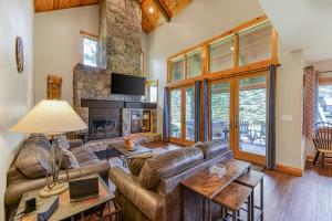 a living room with a couch and a fireplace at Top of the Slopes in McHenry