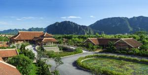 an aerial view of a resort with mountains in the background at Emeralda Resort Ninh Binh in Ninh Binh
